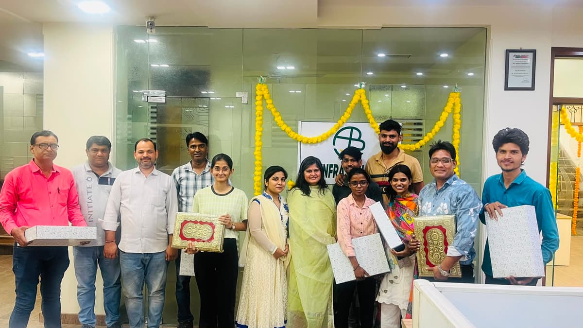 AB Infra team celebrating together in the office