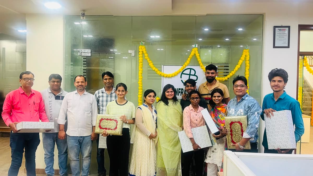 Team celebration with cake at AB Infra office